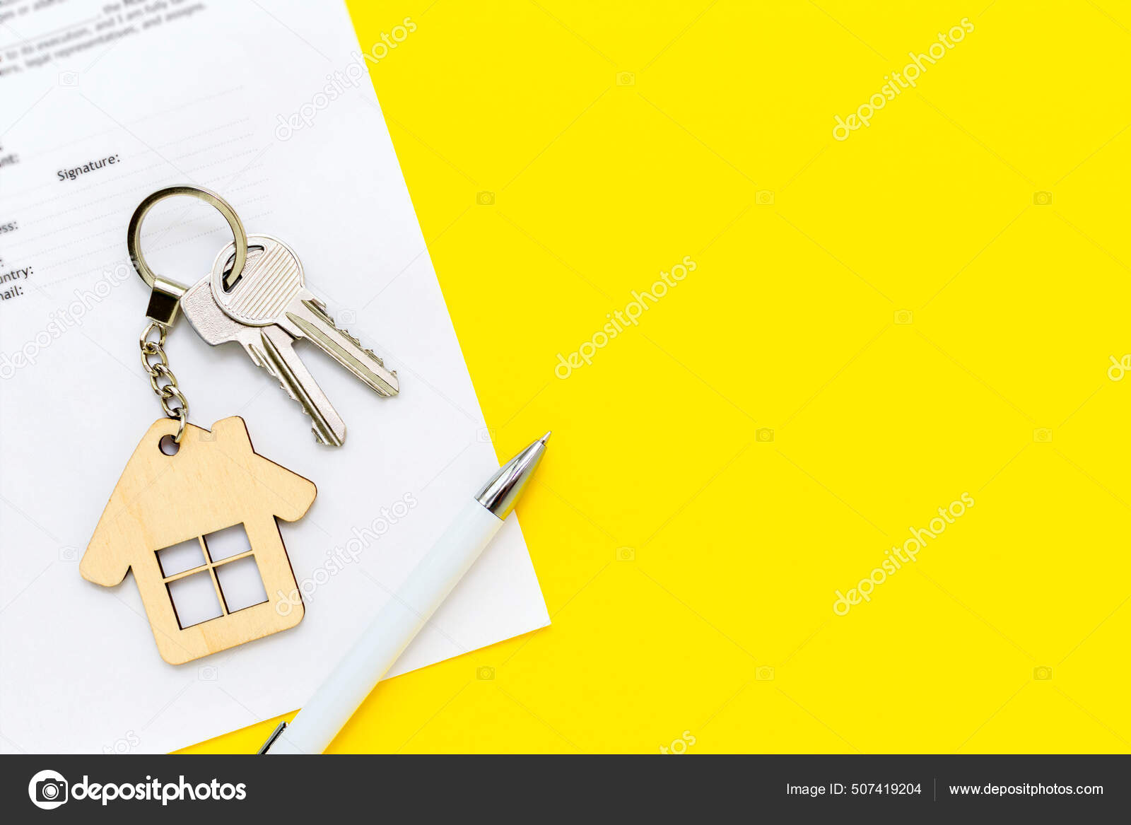 house keys and keychain on mortgage documents